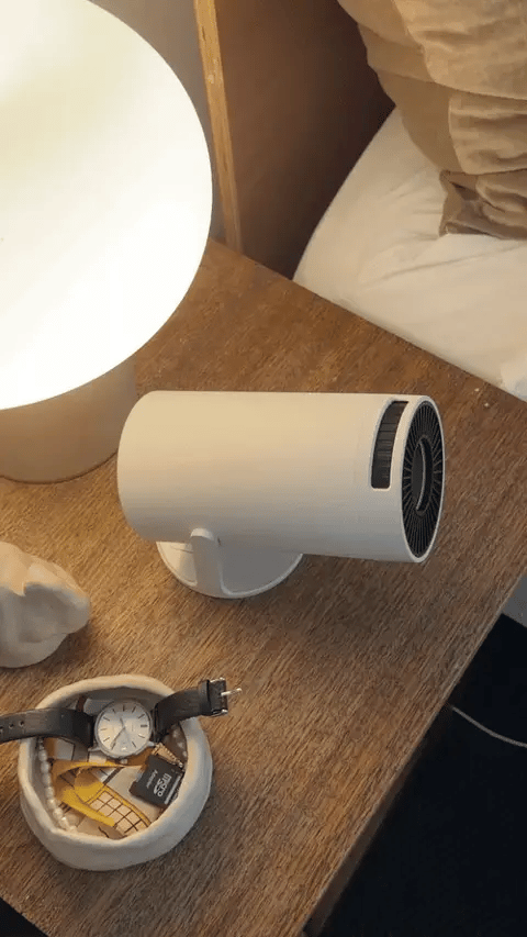 Smart+ sitting on a bedside table next to a lamp